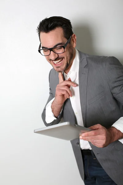 Cheerful salesman using digital tablet — Stock Photo, Image