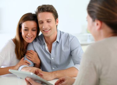 Young couple meeting financial adviser
