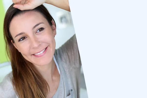 Beautiful brunette girl with hand on forehead — Stock Photo, Image