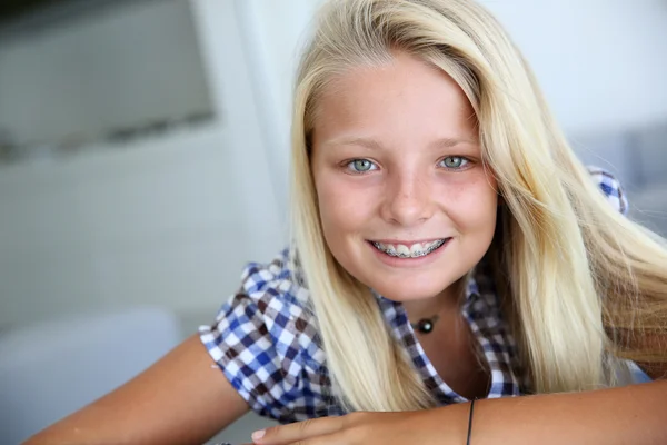 Portrait of smiling blond teenager — Stock Photo, Image