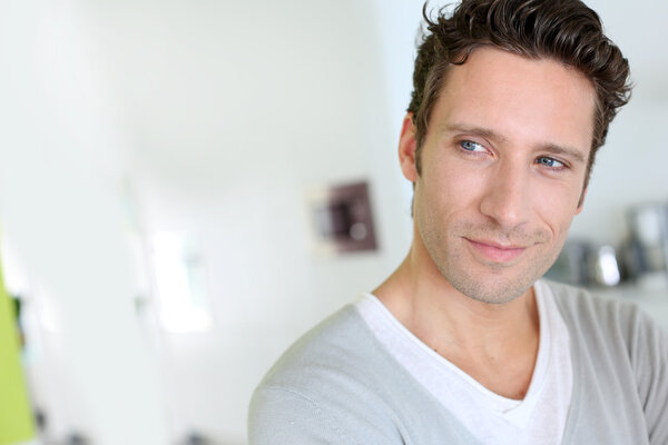 Portrait of handsome man looking at camera