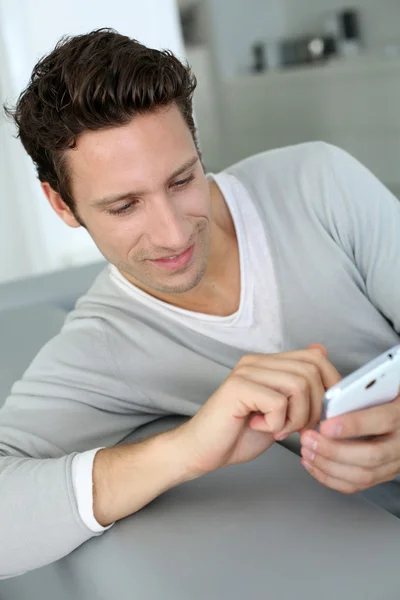 Portrait of man using smartphone Royalty Free Stock Images