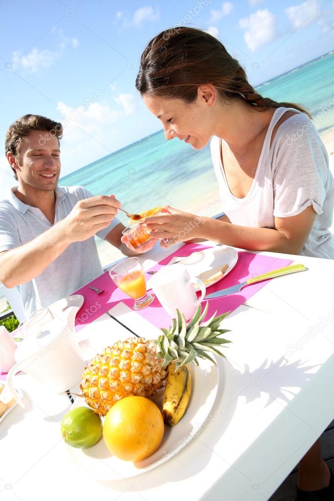 Couple enjoying breakfast in resort