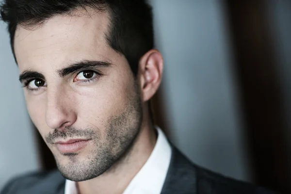 Portrait of handsome man on dark background — Stock Photo, Image