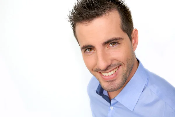 Smiling handsome guy leaning on white background — Stock Photo, Image