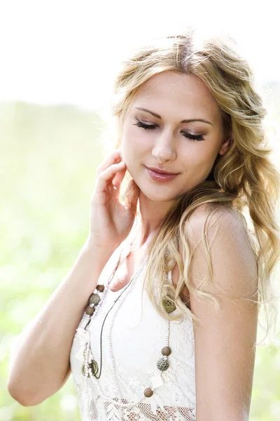 Beautiful blond girl in meadow — Stock Photo, Image