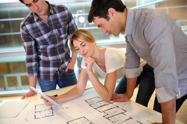 Startup business team working on blueprint — Stock Photo, Image