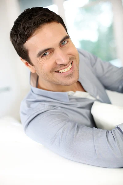 Modern guy relaxing at home in sofa — Stock Photo, Image