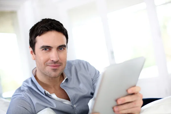 Man websurfing on internet with digital tablet — Stock Photo, Image