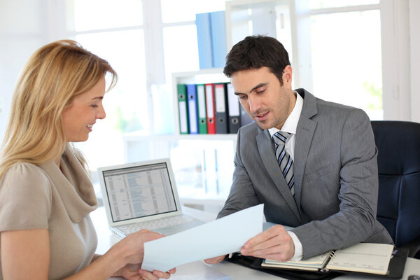 Woman meeting banker to set up her own business