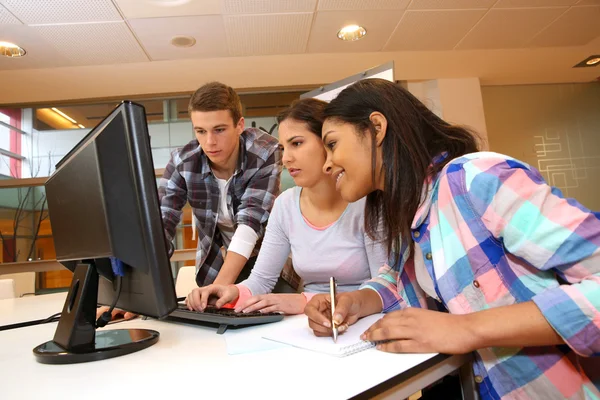 Group of students working in computer lab — Stock Photo, Image