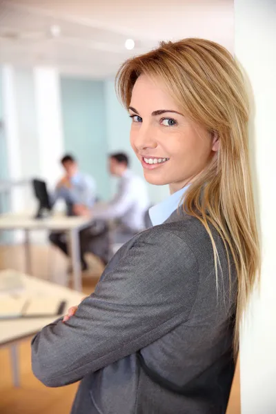 Beautiful blond businesswoman in meeting room Stock Photo