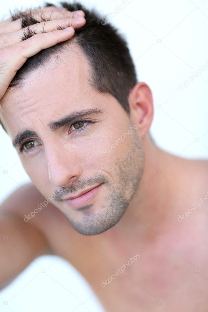 Portrait of attractive man with hair concern