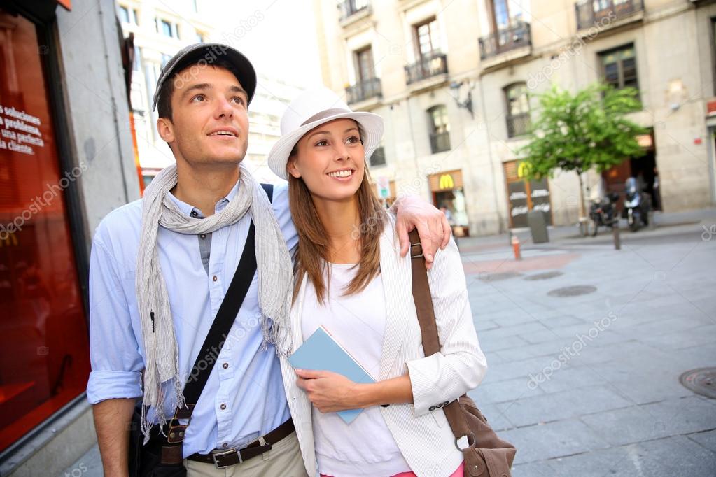 Romantic couple walking in the streets of Madrid, Spain