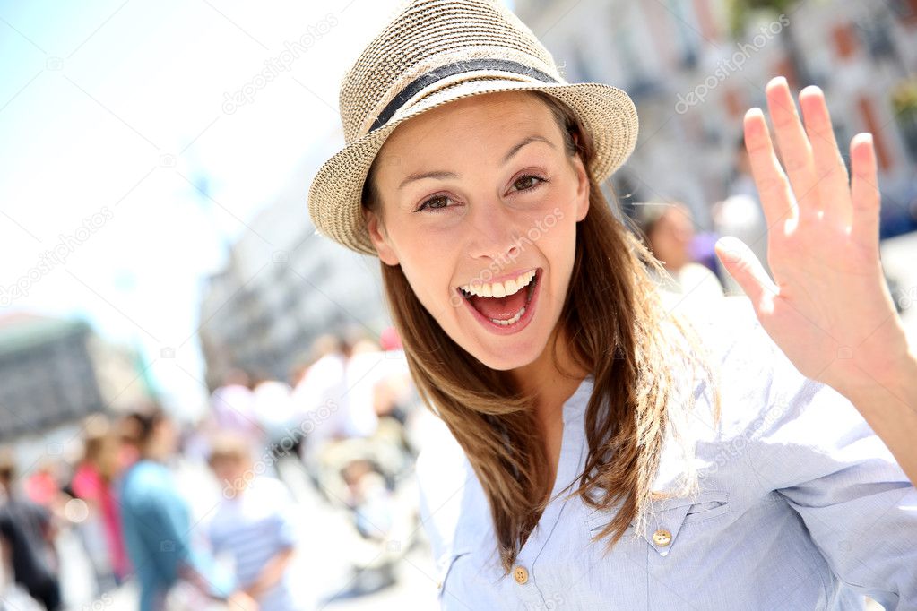 Portrait of cheerful beautiful girl in town