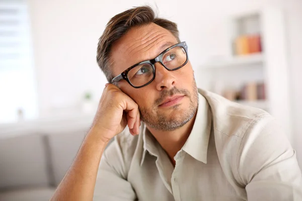 Man with eyeglasses being thoughtful — Stock Photo, Image
