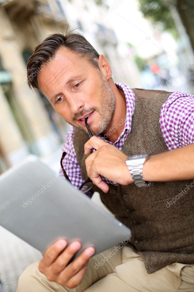 Stylish man reading news on internet