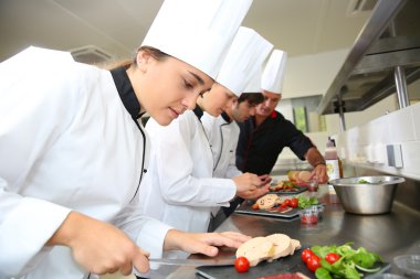 Chefs preparing delicatessen dishes clipart
