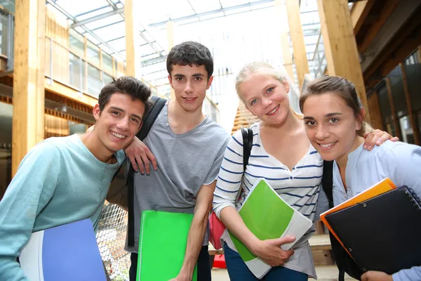 Cheerful students in school yard — Stock Photo, Image