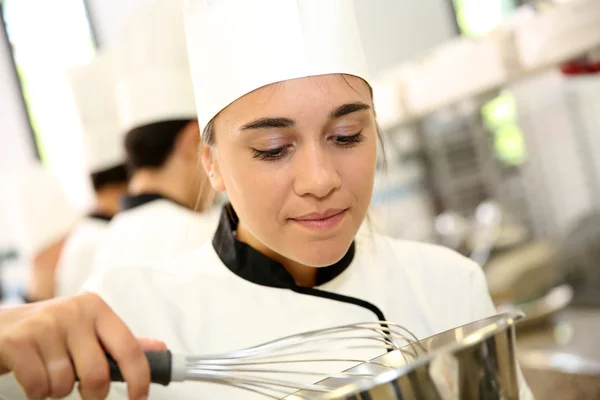 Student in pastry holding whip — Stock Photo, Image