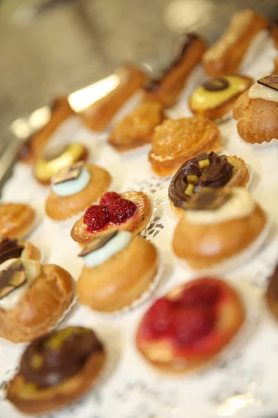 Delicious French pastries on tray — Stock Photo, Image