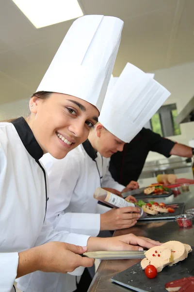 Chefs preparing delicatessen dishes — Stock Photo, Image