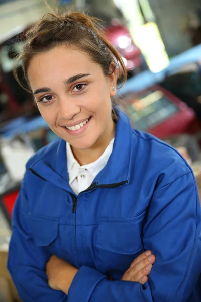 Girl standing in garage — Stock Photo, Image