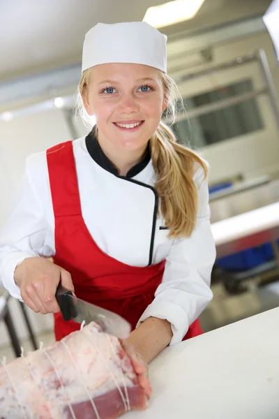 Smiling young butcher girl — Stock Photo, Image