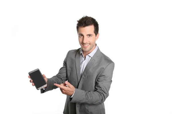 Empresário apresentando aplicação no smartphone — Fotografia de Stock