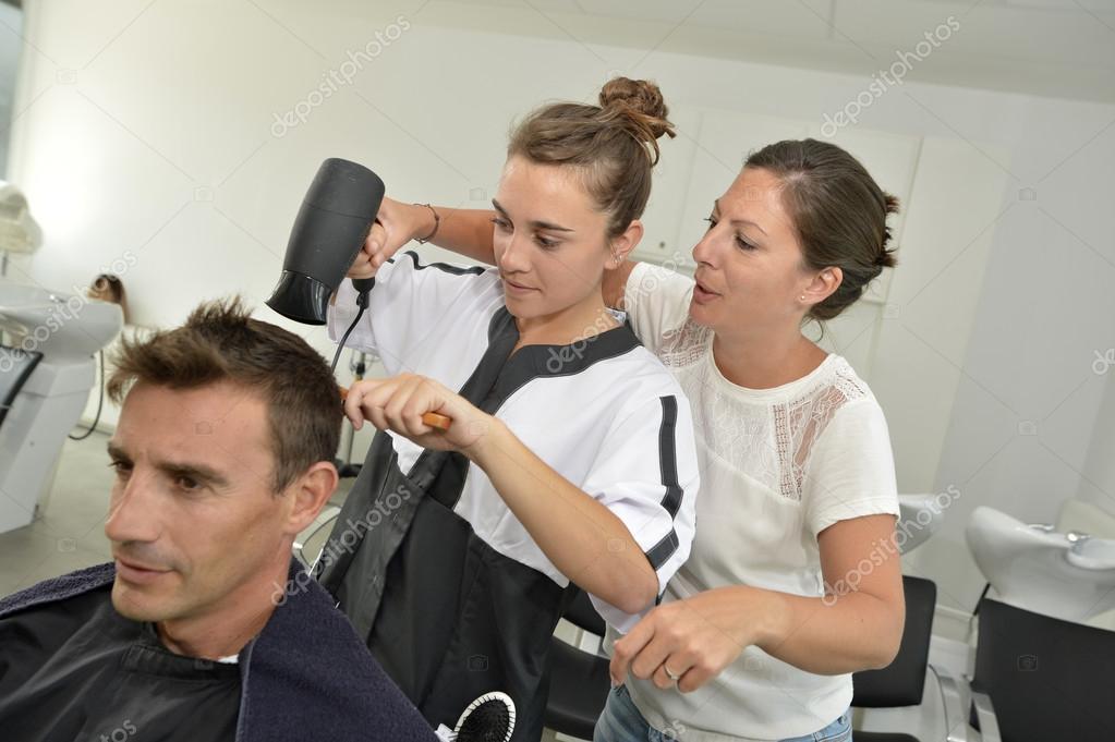 Hairstyle training class in beauty salon Stock Photo by ©Goodluz 35260741