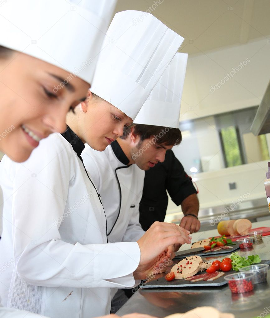 Chefs preparing delicatessen dishes