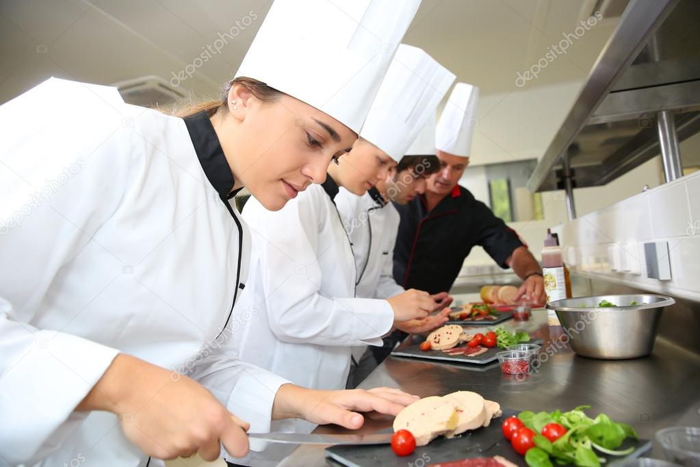 Chefs preparing delicatessen dishes