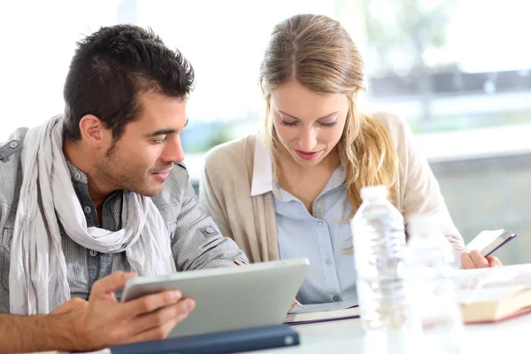Classmates working together with digital tablet — Stock Photo, Image