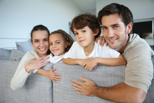 Family relaxing in sofa — Stock Photo, Image