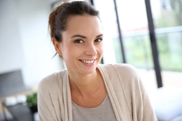 Woman relaxing in living-room Stock Image