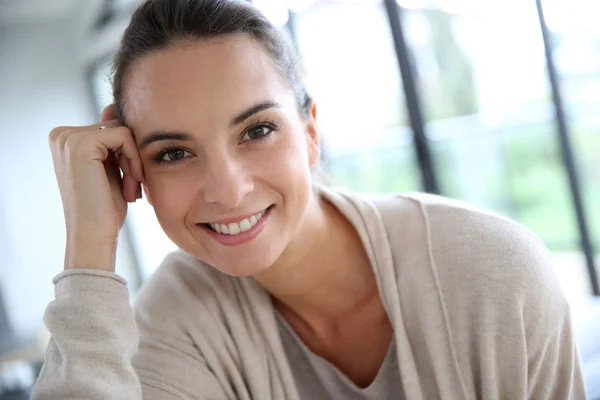 Woman relaxing in living-room Stock Photo