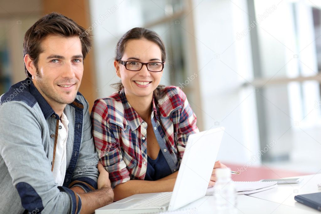 People working on laptop computer