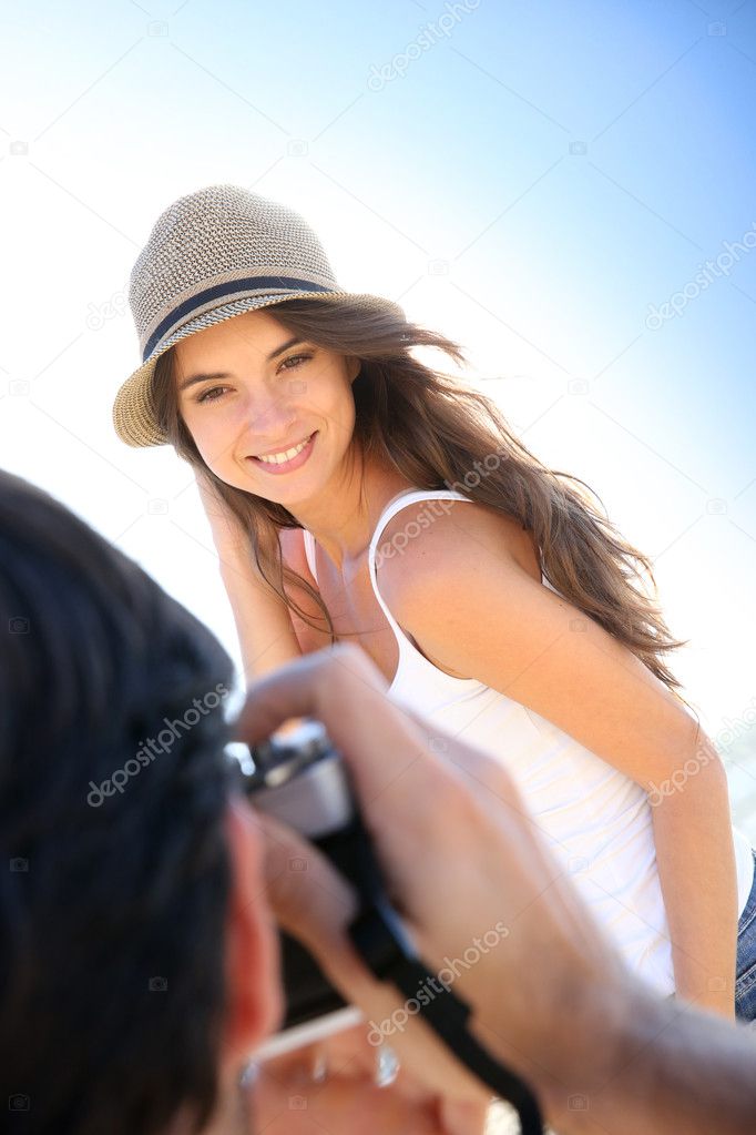 Man taking picture of woman
