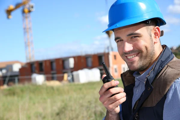 Construction manager with walkie-talkie — Stock Photo, Image