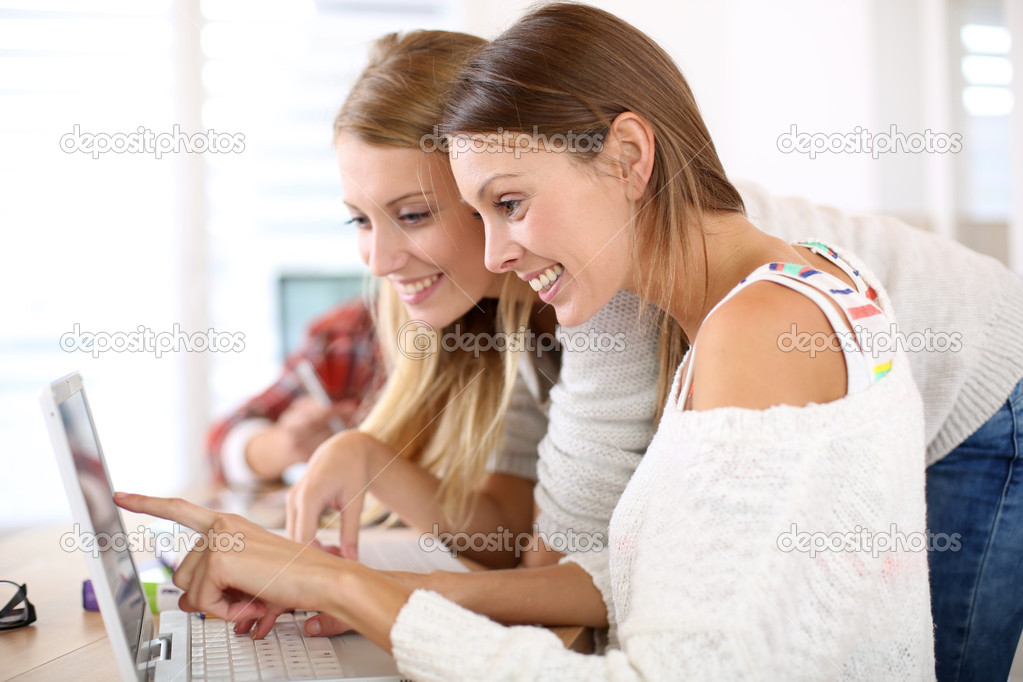 Girls studying on laptop computer