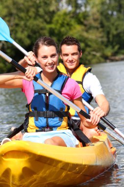 Couple in canoe clipart