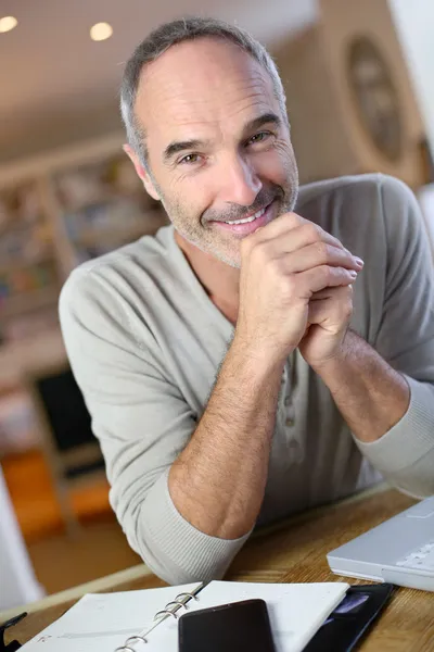 Mature man working from home — Stock Photo, Image