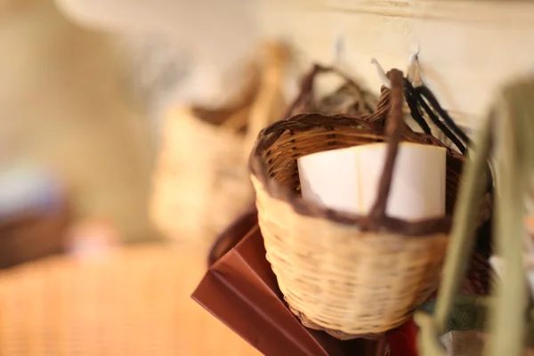 Wicker basket hooked on wall — Stock Photo, Image