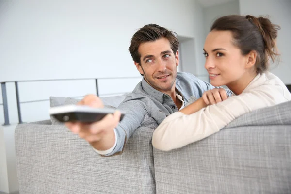 Couple on sofa — Stock Photo, Image