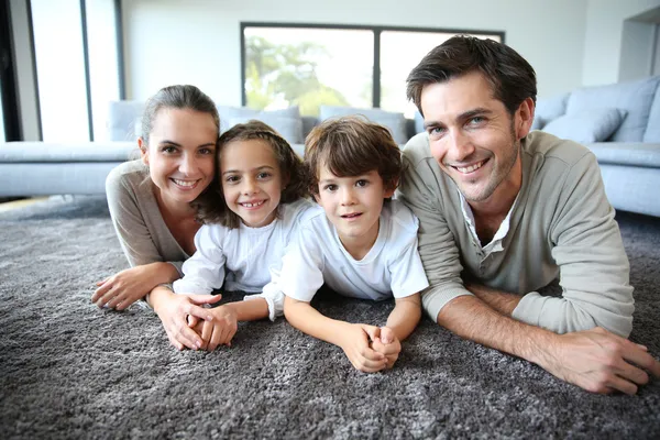 Smiling family at home — Stock Photo, Image