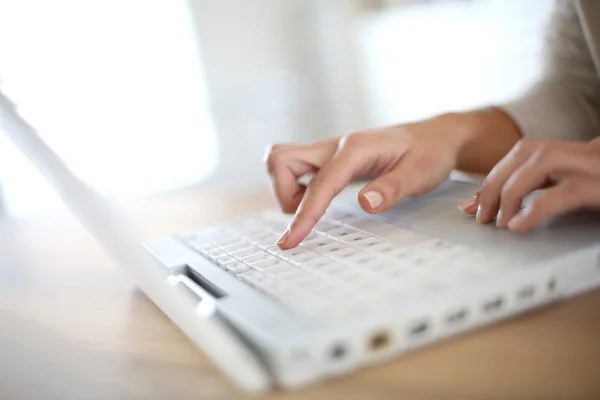 Hand typing on laptop keyboard — Stock Photo, Image