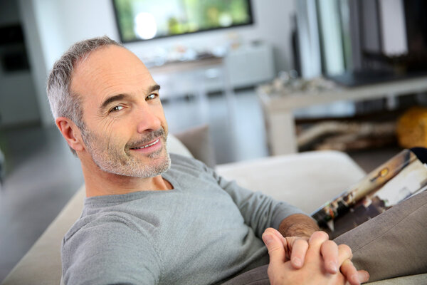 man sitting on couch