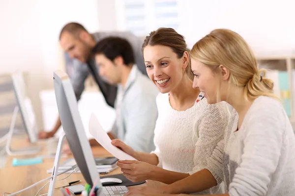 Smiling college girls working — Stock Photo, Image