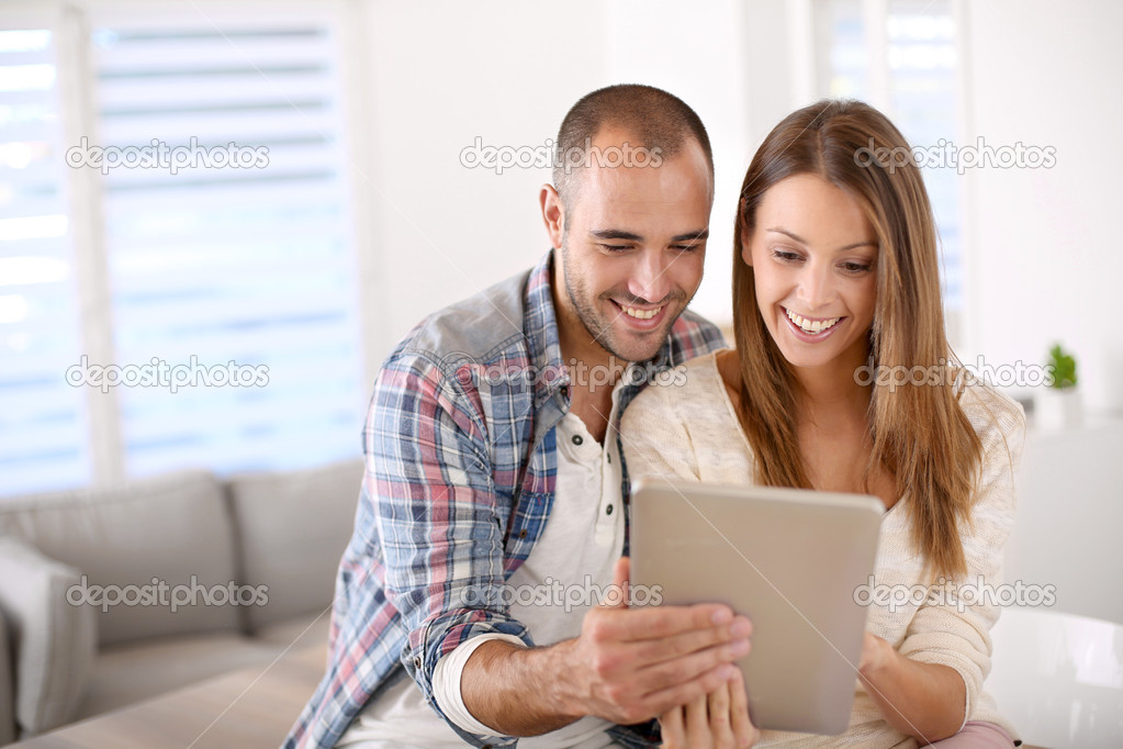 Smiling couple with notebook