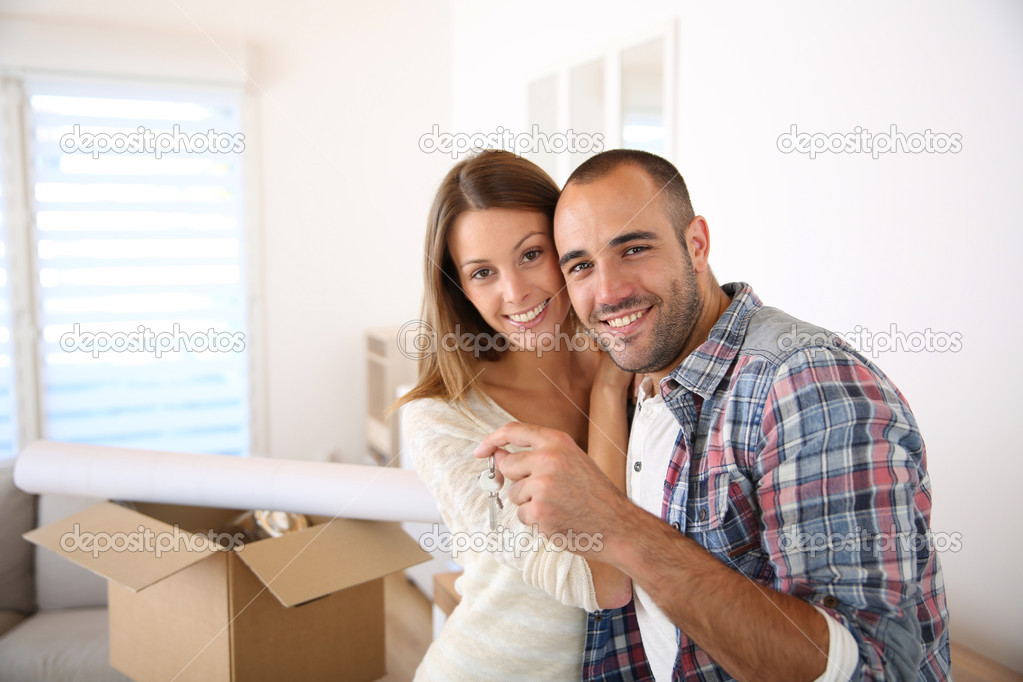 Happy couple holding key